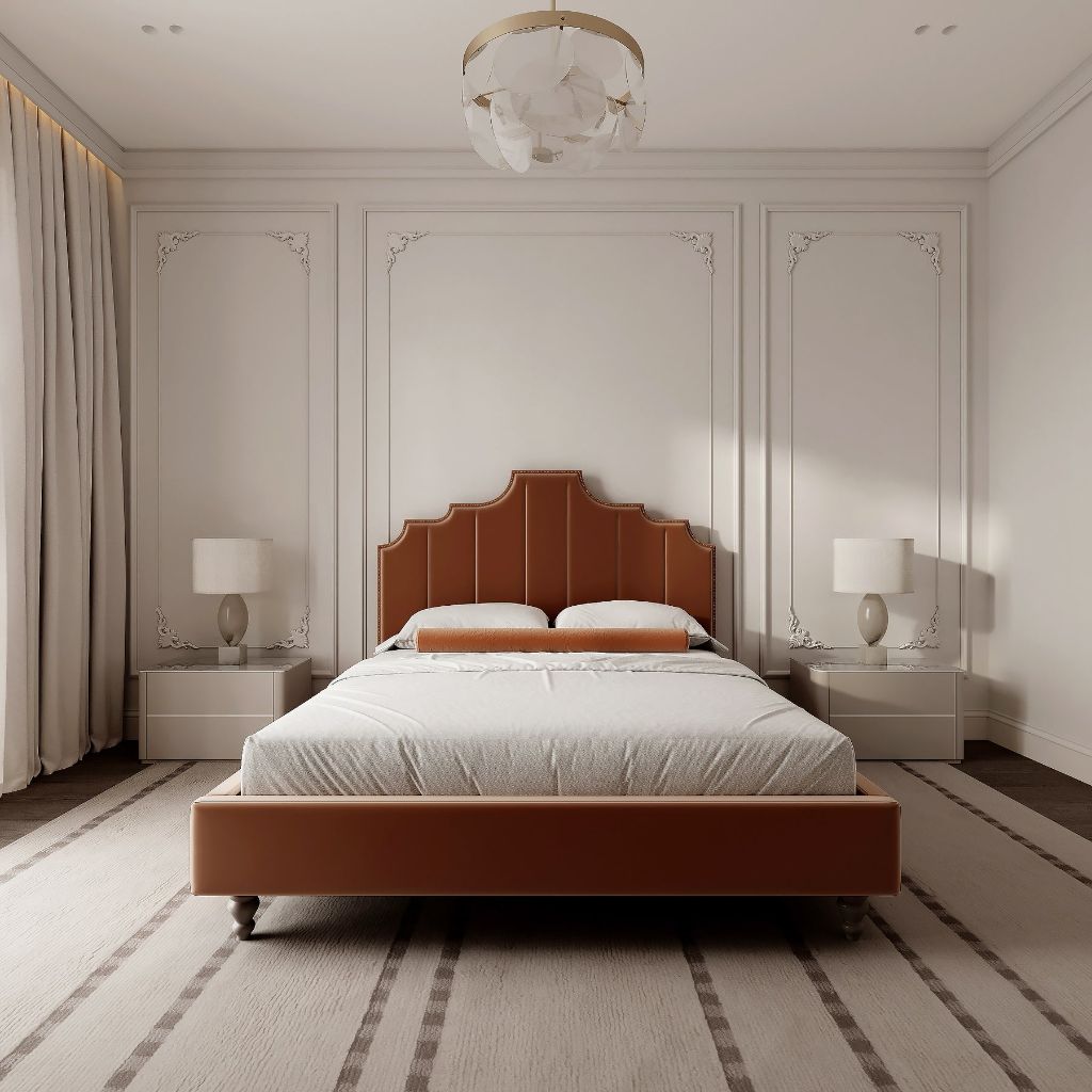 Curved velvet bed in a styled room